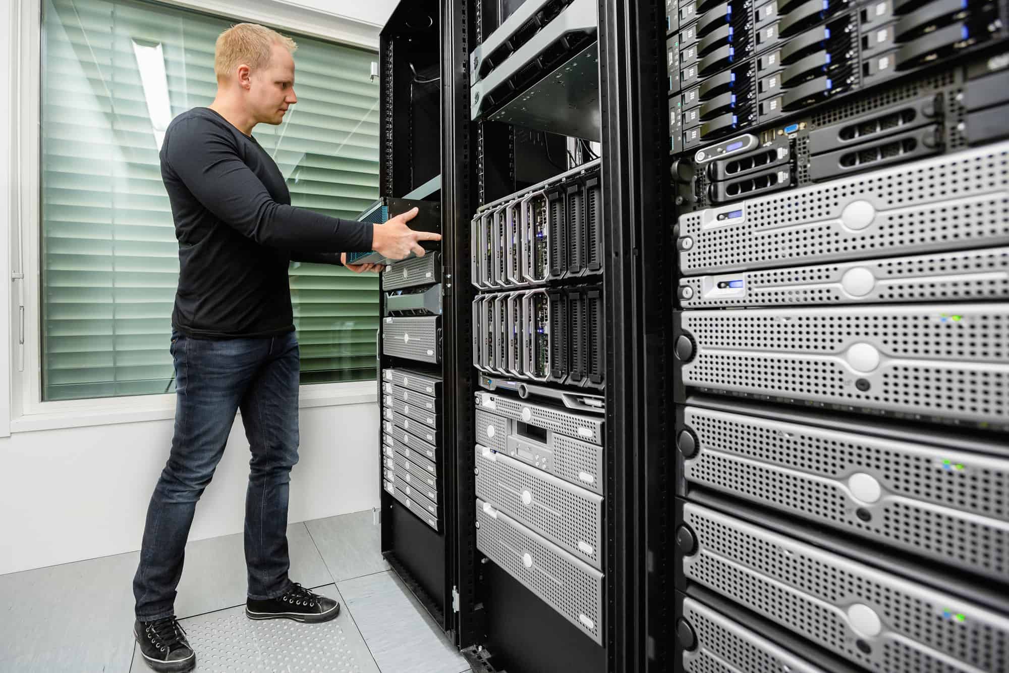 a man wearing a black long sleeves in the data center relocation