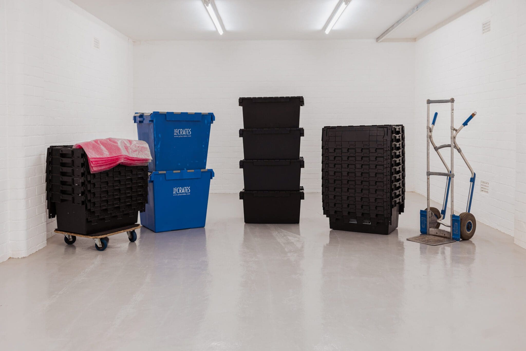 group of plastic crates and other proper removal equipment for hire.
