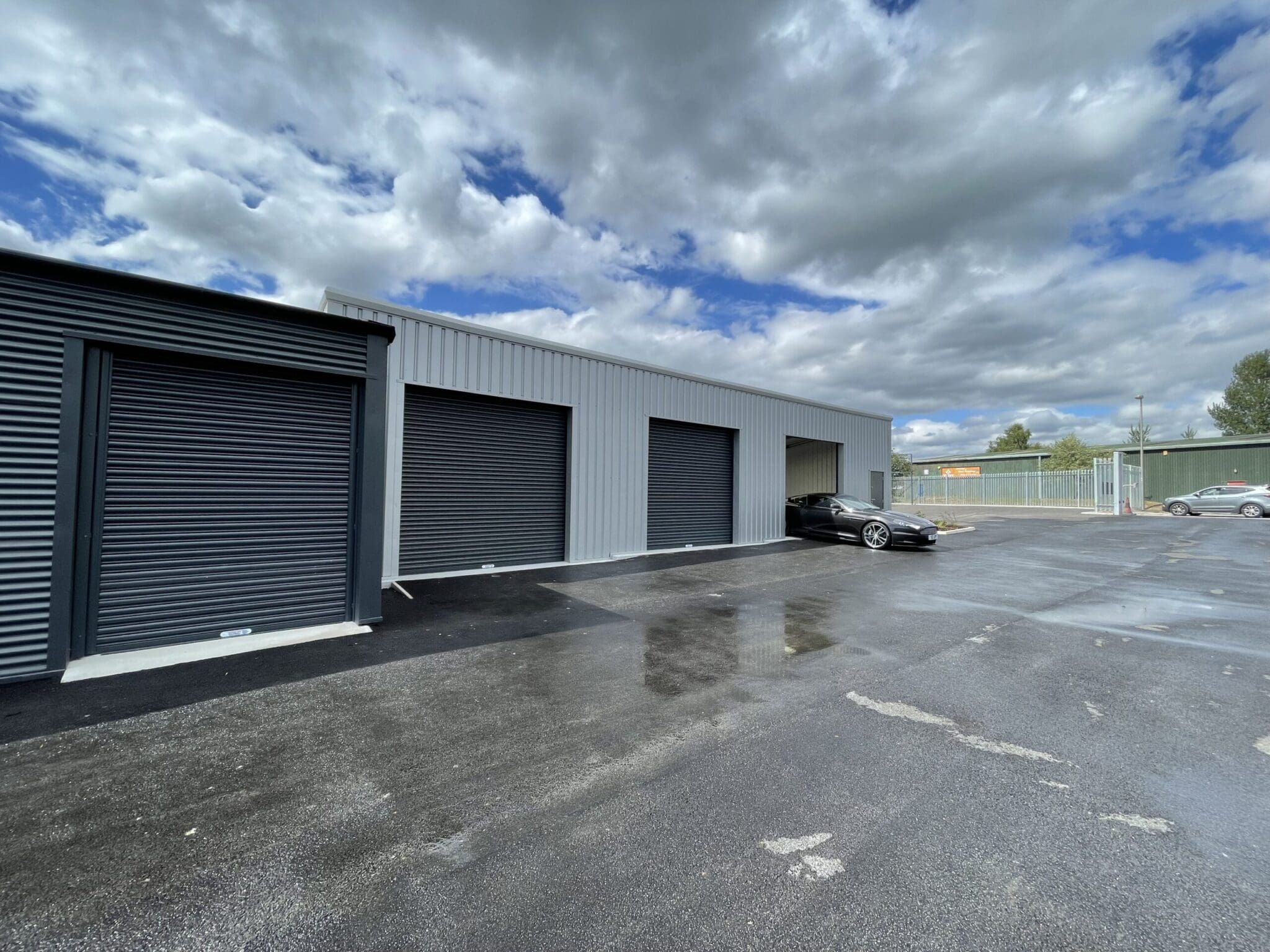 a storage facility with a black roller shutter