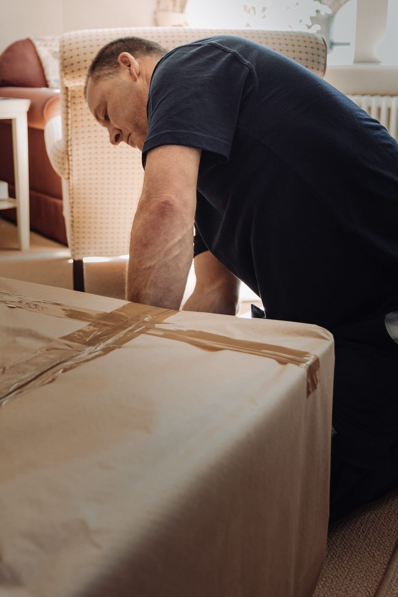 man taping and securing a packaging for a safety removals